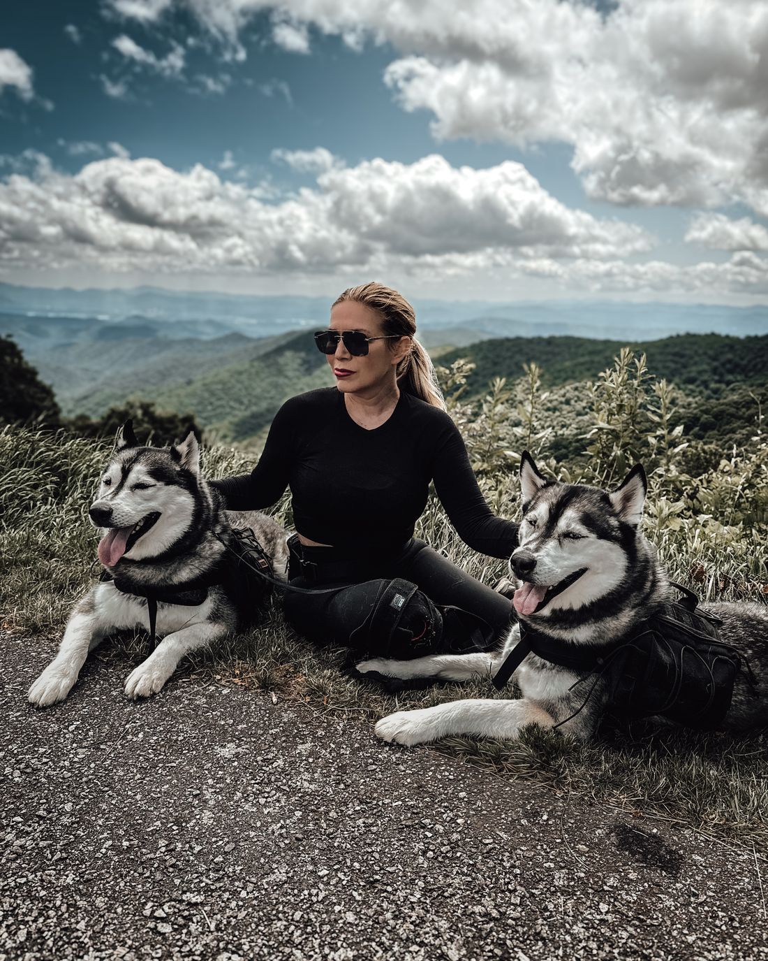 Tracy with Luka and Sosa on a mountain overlook